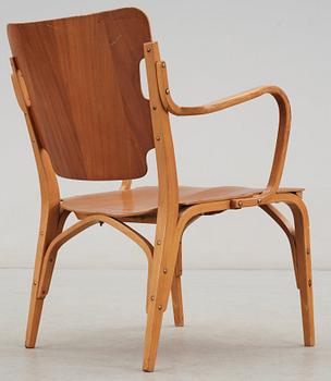 A Carl-Axel Acking mahogany and beech armchair, Svenska Möbelfabrikerna, Bodafors, Sweden 1940's.