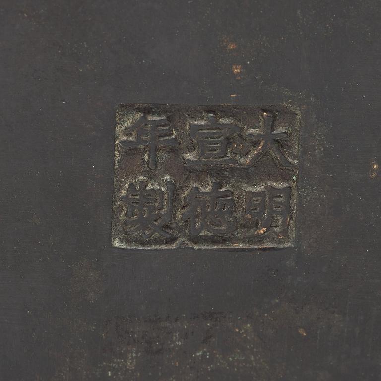 A bronze incense burner carried by two men, Qing dynasty (1644-1912), with Xuande mark.