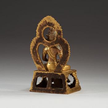 A gilt bronze figure of Bodhisattva, Qing dynasty, 18th Century. With inscription to base.