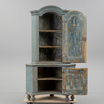 A 18th century corner cabinet.