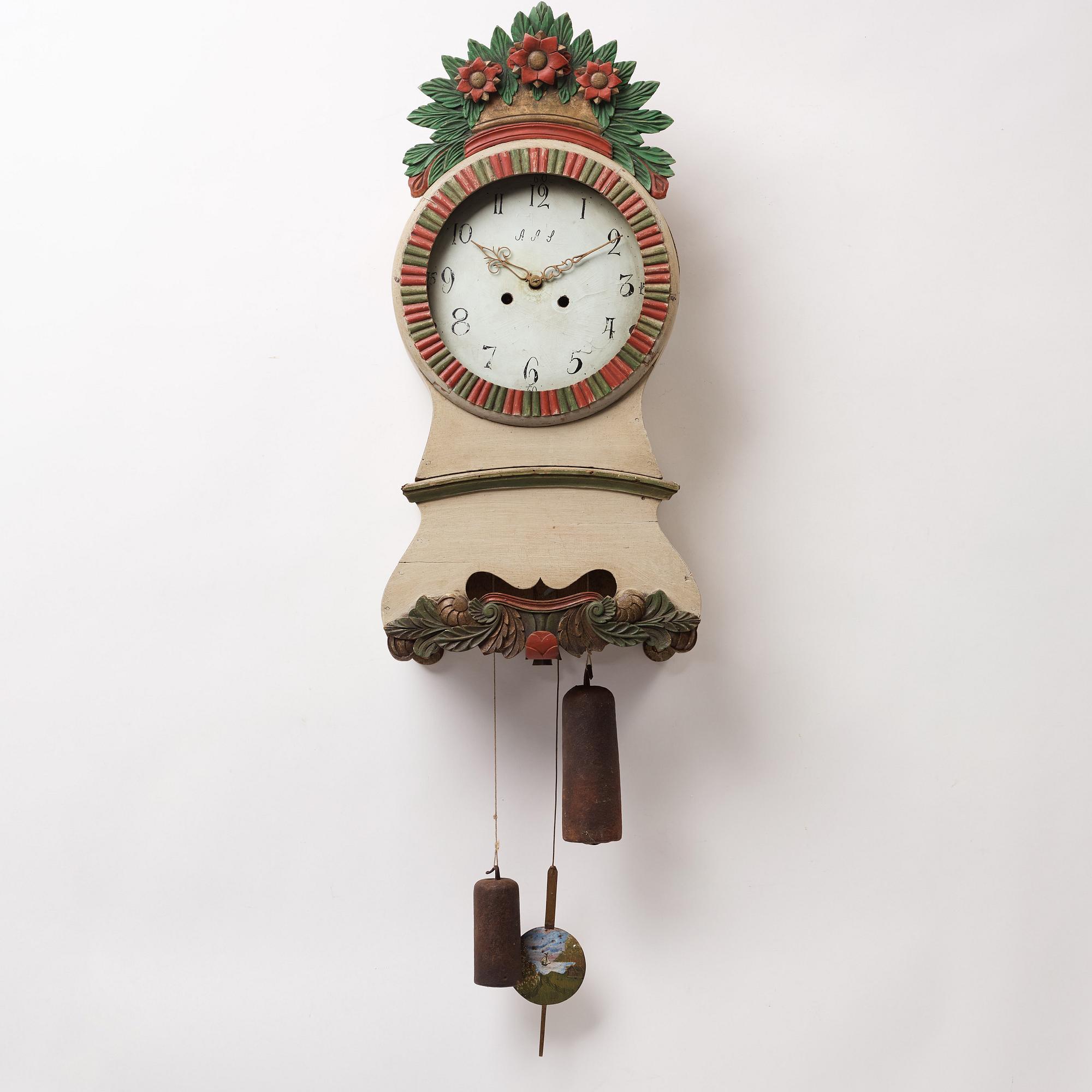 a painted wall pendulum clock from Ångermanland in the first half of the 19th century.