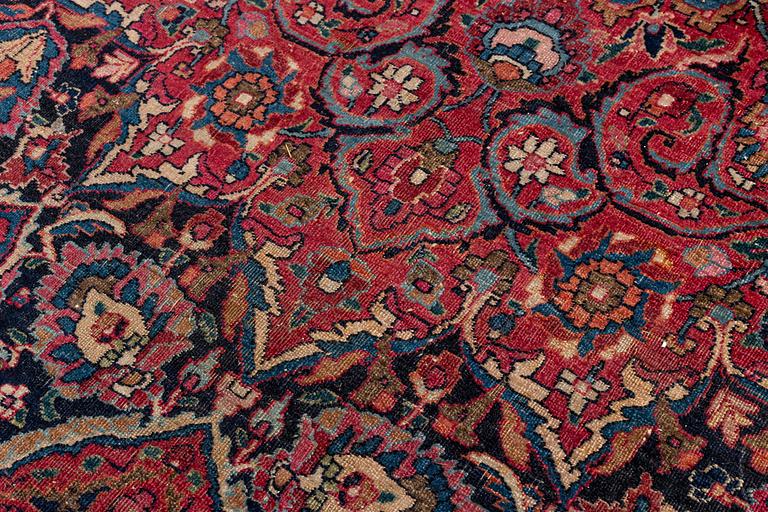 An antique Moud carpet of 'Ardabil' design, approximately 445.5 x 332 cm.