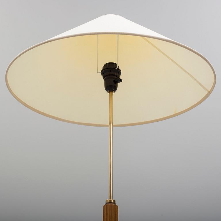 A Bergboms brass and beech standard light, 1940's.