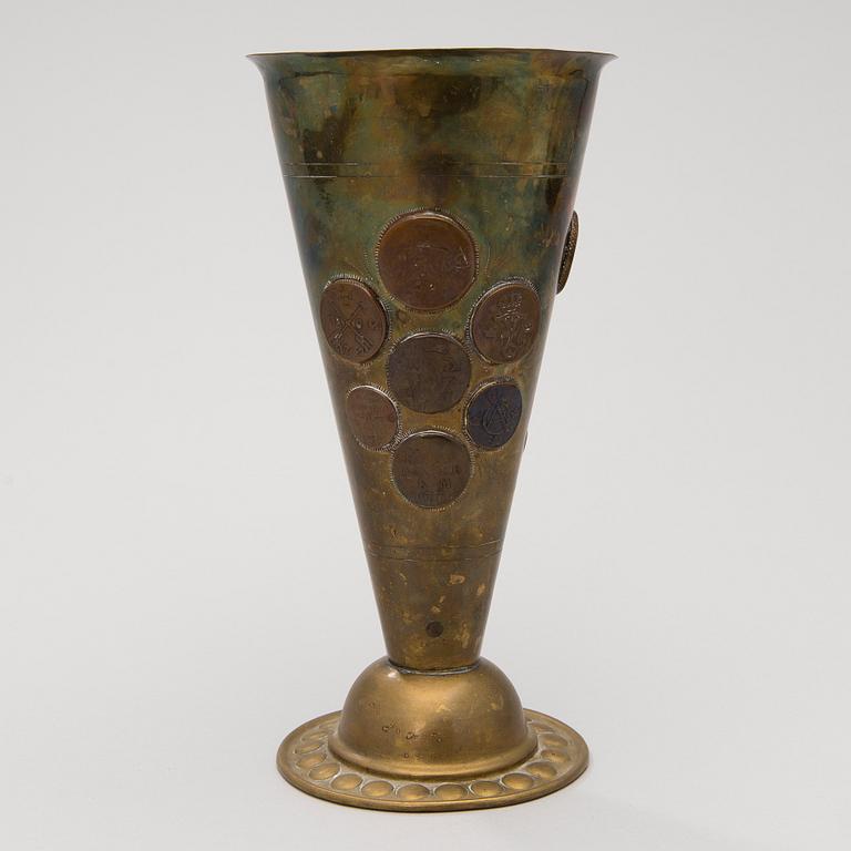 A late 19th Century brass cup.