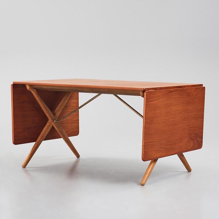 Hans J. Wegner, a teak and oak drop-leaf dining table, Andreas Tuck, Denmark 1950s-1960s.