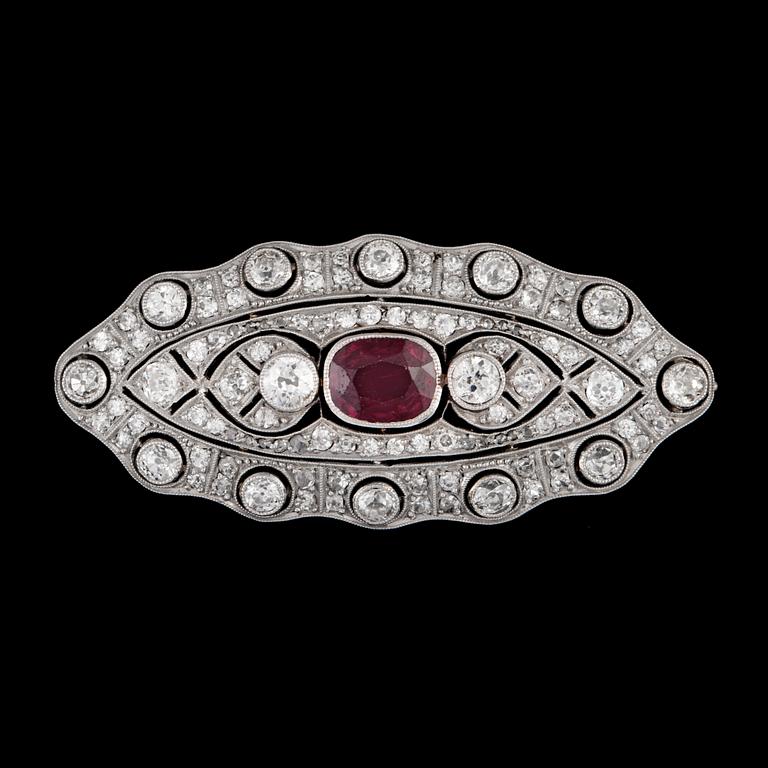 A circa 1.75 ct ruby and old-cut diamond, circa 2.50 cts in total, brooch.