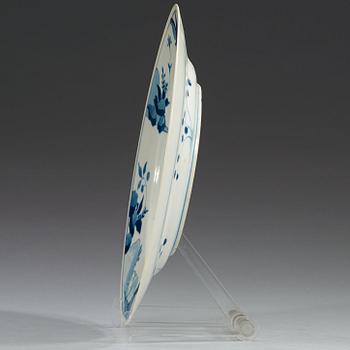 A set of four blue and white dinner plates, Qing dynasty, with Kangxi six character mark and period (1662-1722).