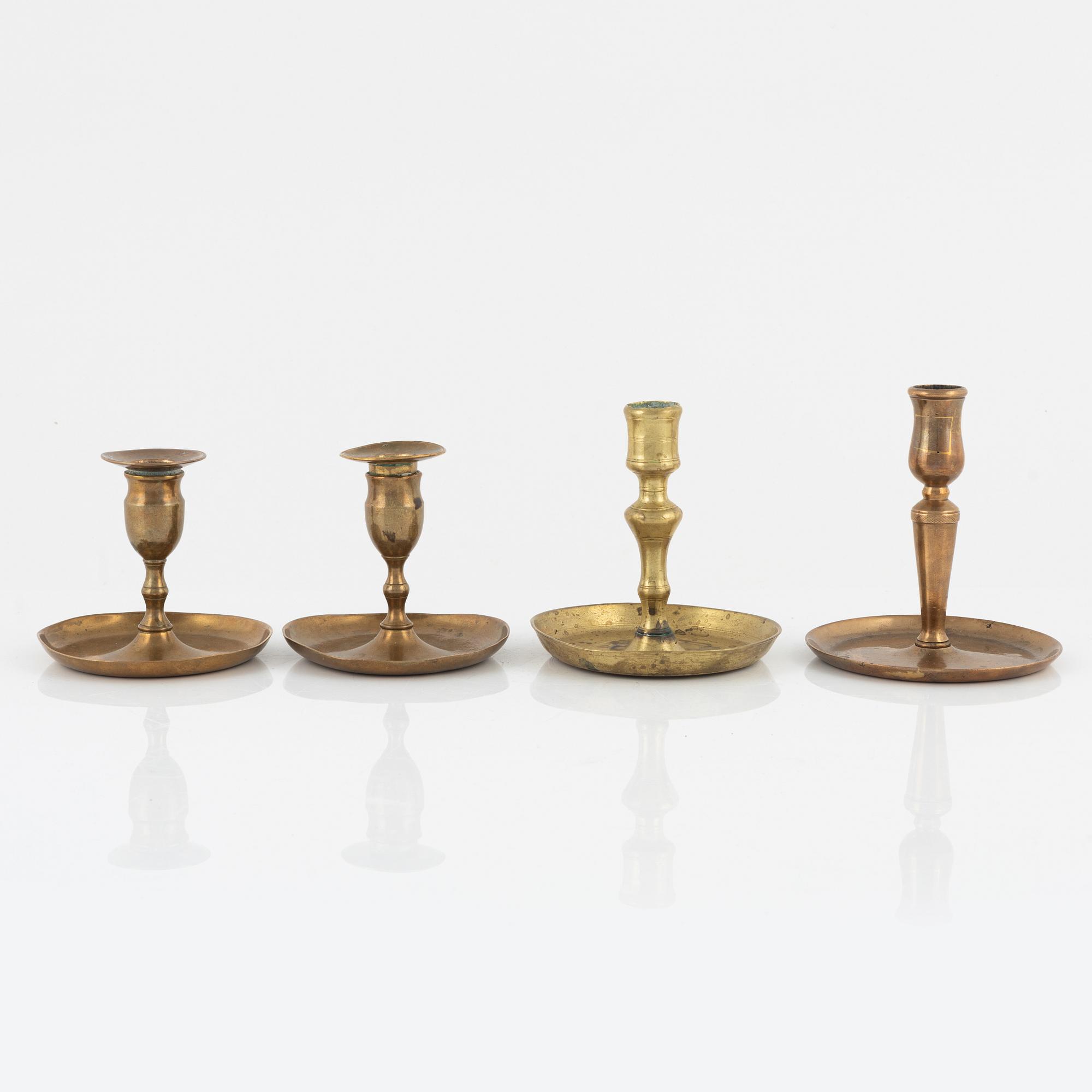 Four bronze candlesticks, a pair of which Skultuna model N 60, 18th-19th Century.