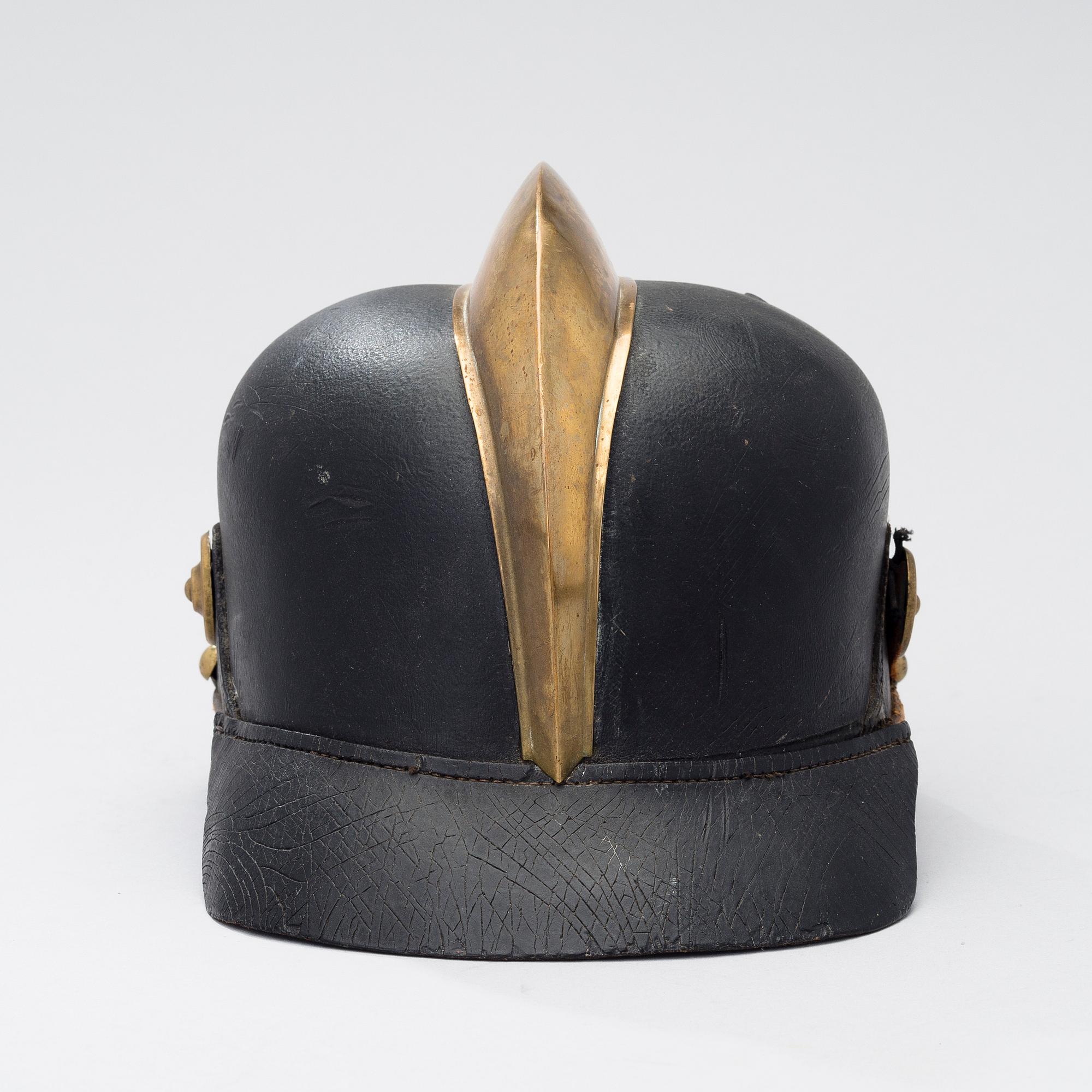 An early 20th century fireman helmet.