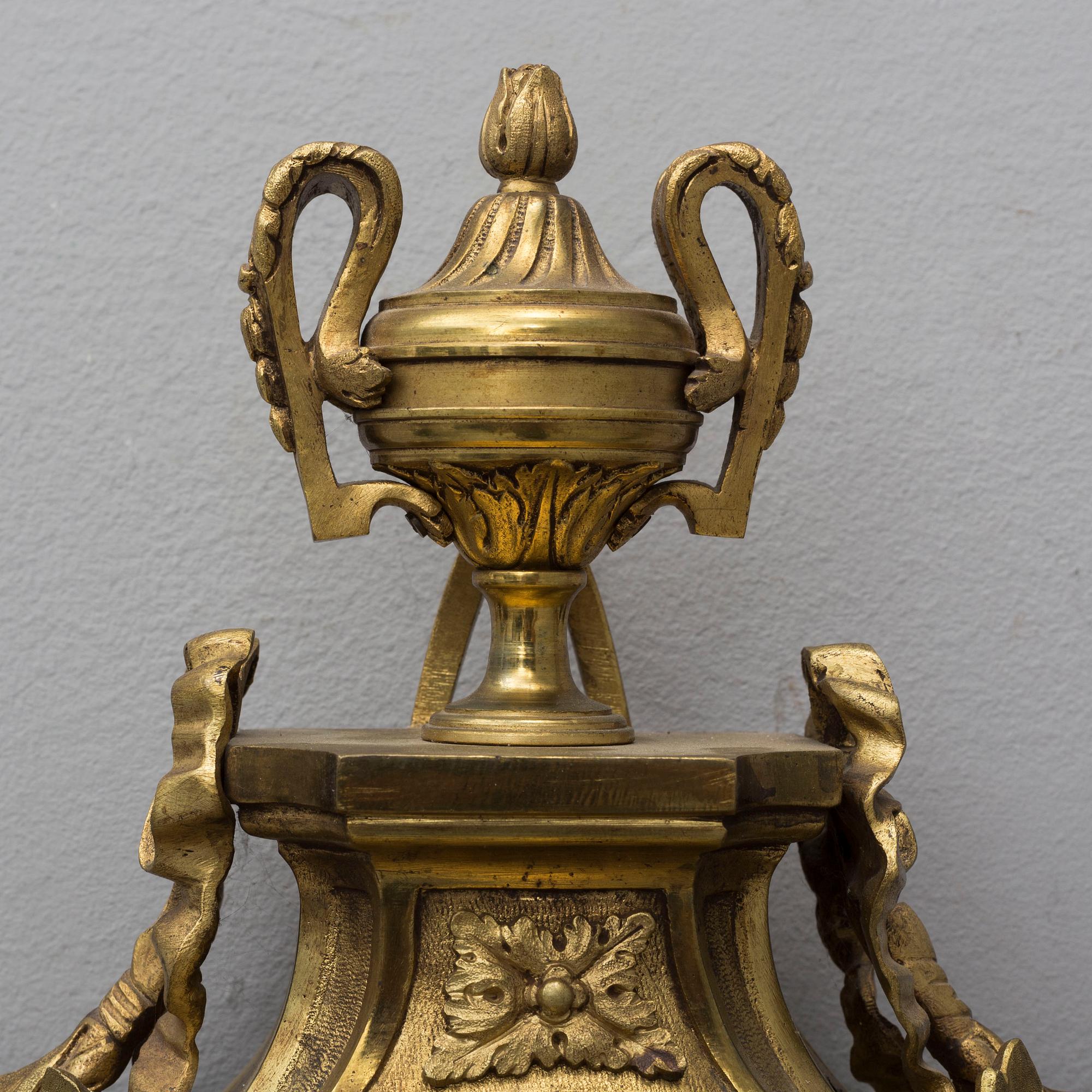 A brass wall clock marked A.W. Bruuns eftr, Lund from around year 1900.