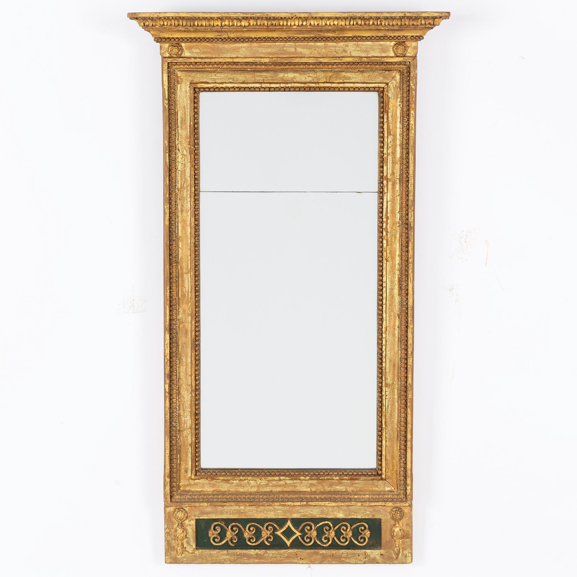 An Empire mirror, first half of the 19th Century.