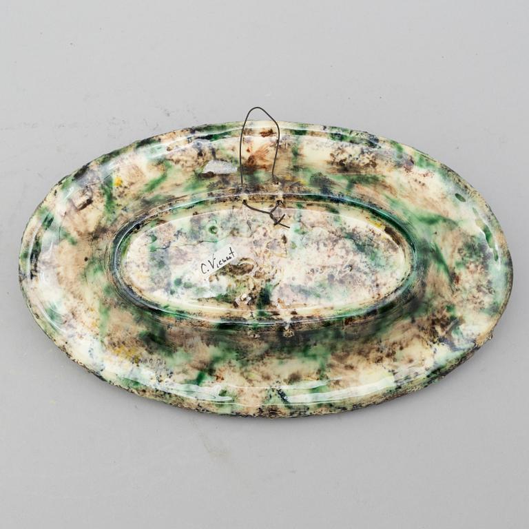A richly decorated Palissy-style majolica plate, 19th century.