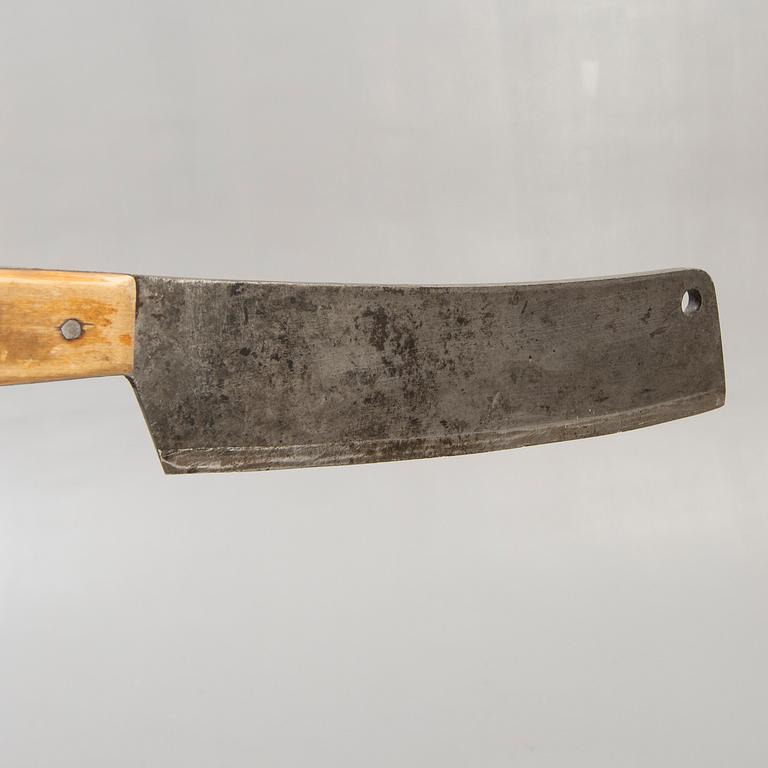 A Swedish early 1900s chopping block with knife.