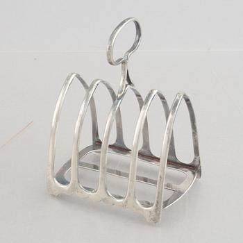 A set of four English silver salt cellars and a toast rack, including Roberts & Belk, Sheffield, England 1898.