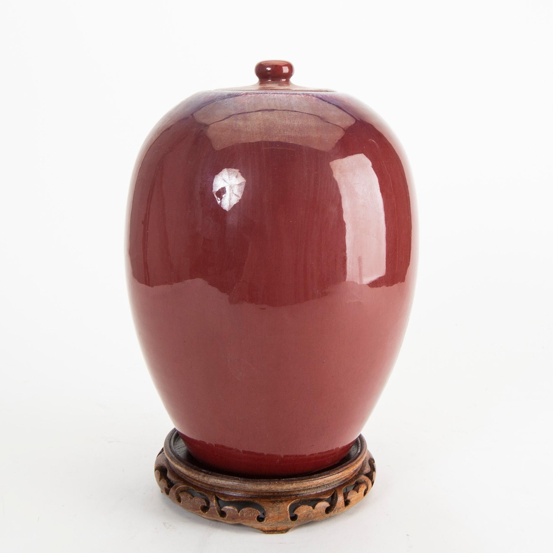 A sang de boef/flambe glazed jar with cover, Qing dynasty, circa 1900.
