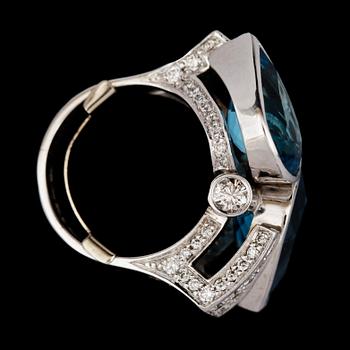 A blue topaz and brilliant cut diamond ring,