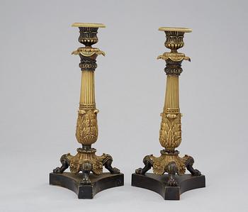 189. A pair of French 19th century bronze candlesticks.