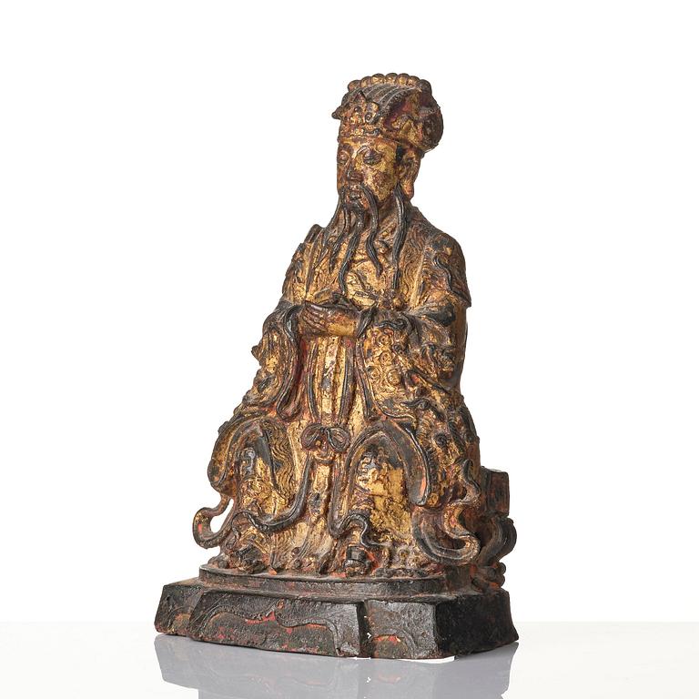A Chinese gilt lacquered figure of a daoist deity, Ming dynasty (1368-1644).
