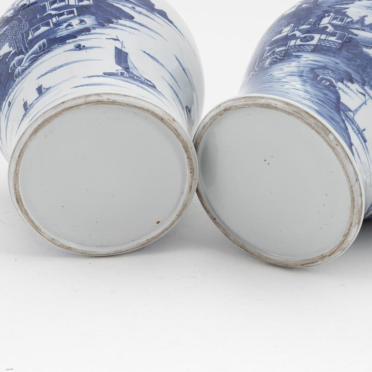 A pair of blue and white Chinese porcelain jars with covers. Qing dynasty, Qianlong (1736-95).