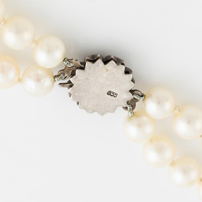 Cultured two strand pearl necklace, clasp silver with paste.