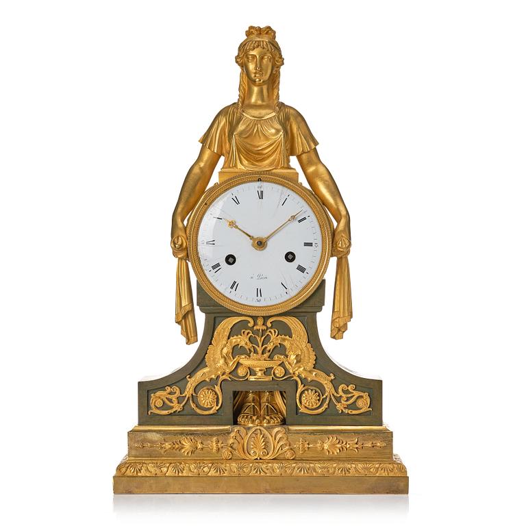 An Empire bronze mantle clock.