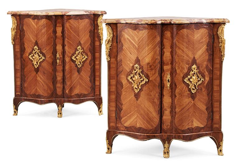 A pair of Louis XV 18th century corner cabinets by F. Reizell.