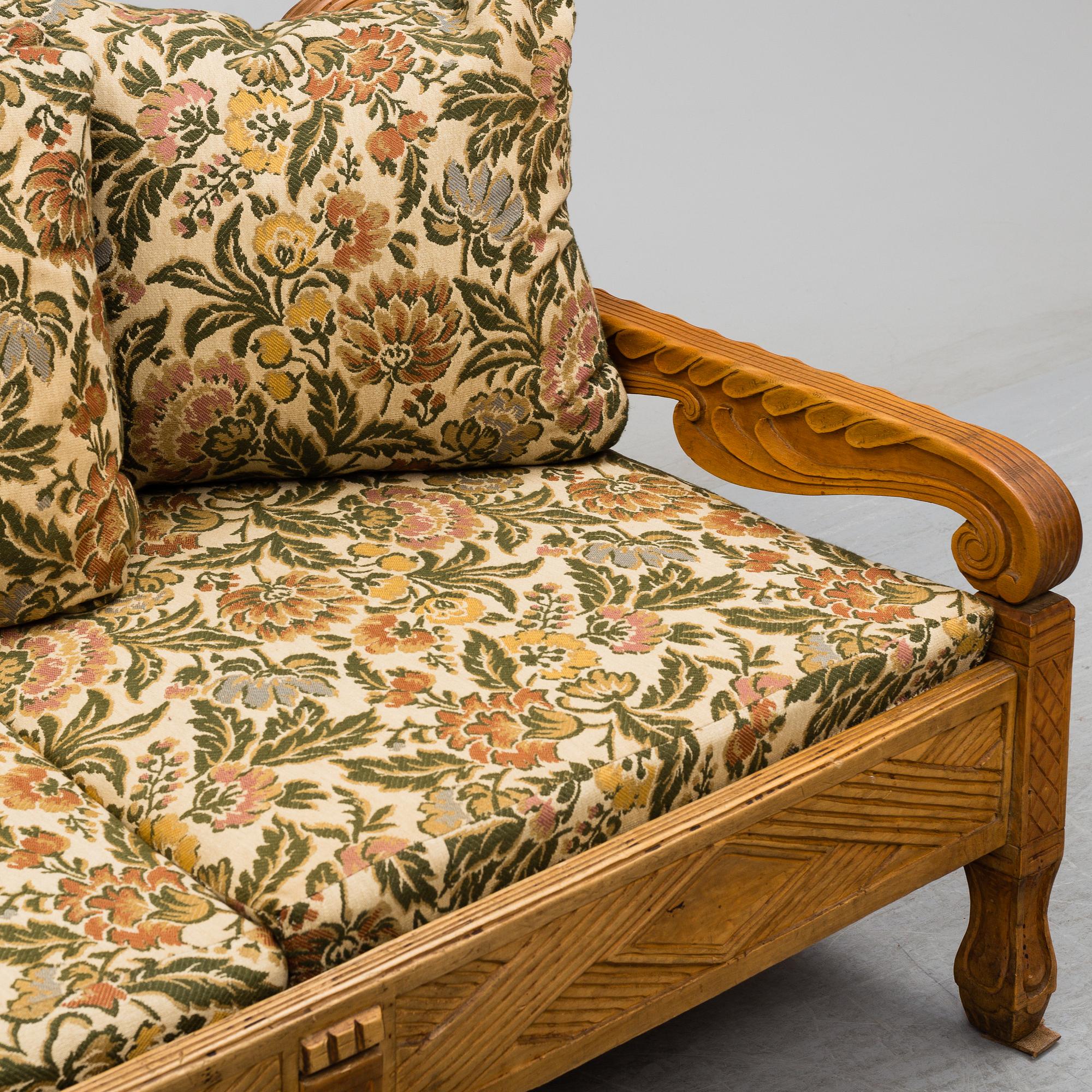 KNUT FJAESTAD, a folk art stained wood sofa/bed,  Sweden, early 20th C.