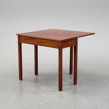 A mahogany games table, circa 1800.