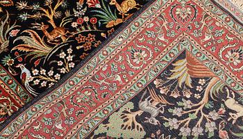 A Tabriz silk rug, approx. 155 x 100 cm.