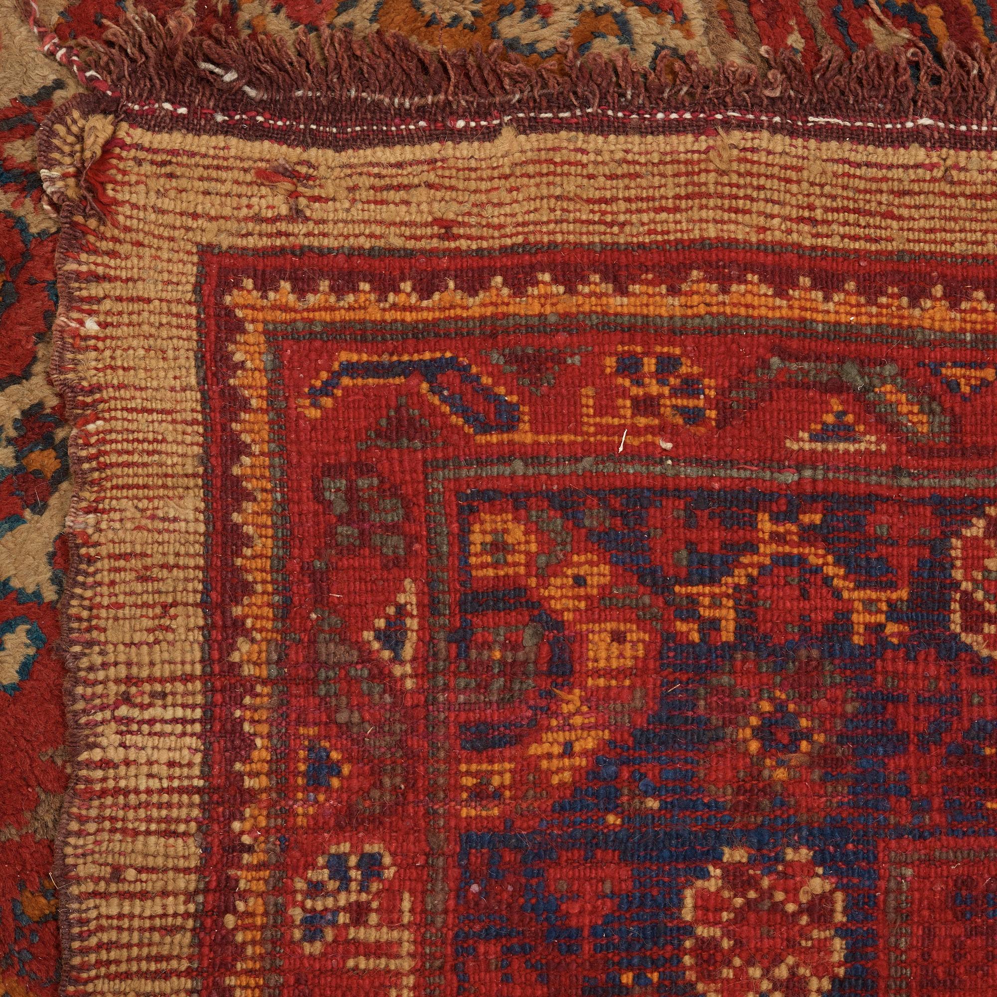A CARPET. An antique Ushak. 554,5 x 480 cm.