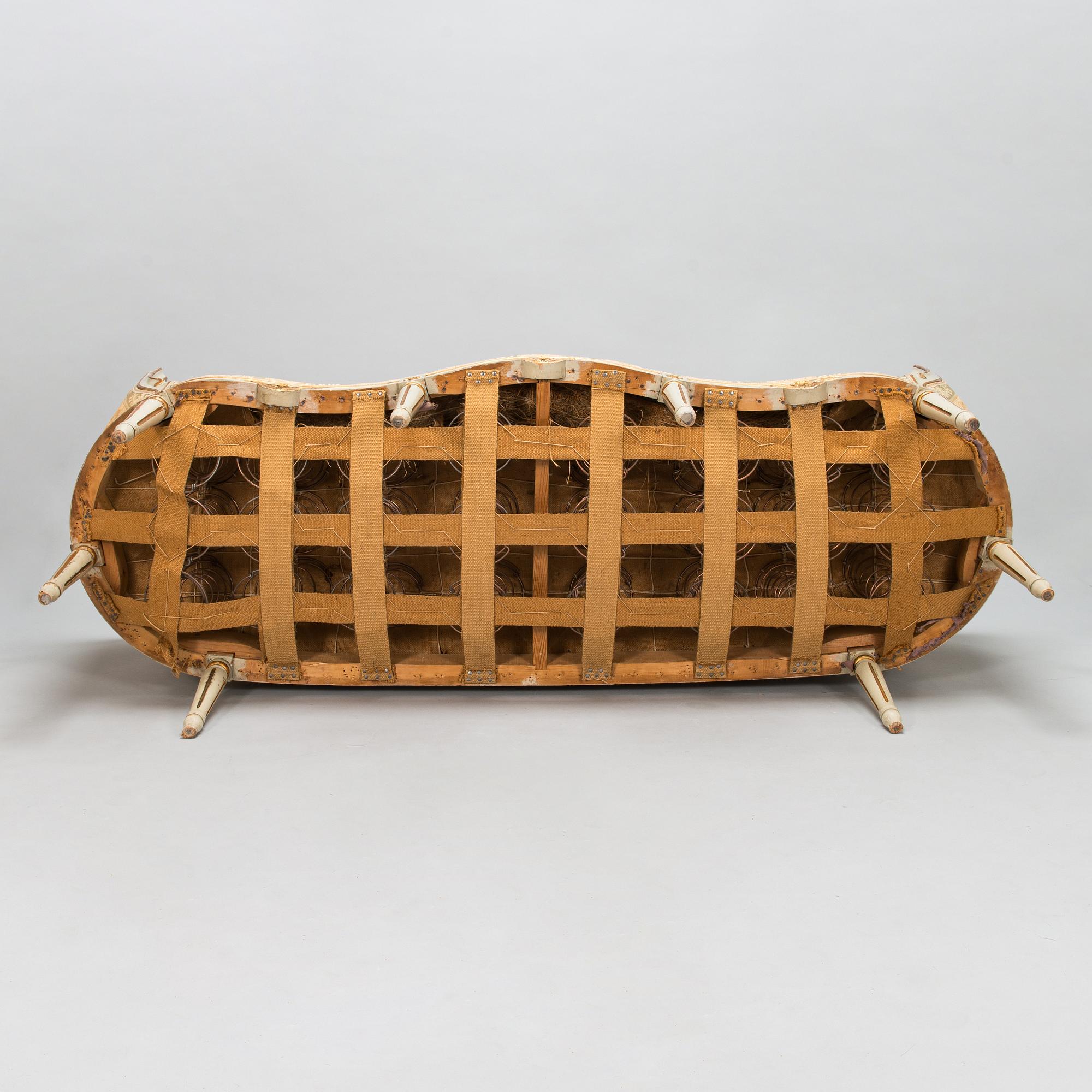 A Gustavian style sofa and table from early 20th century.