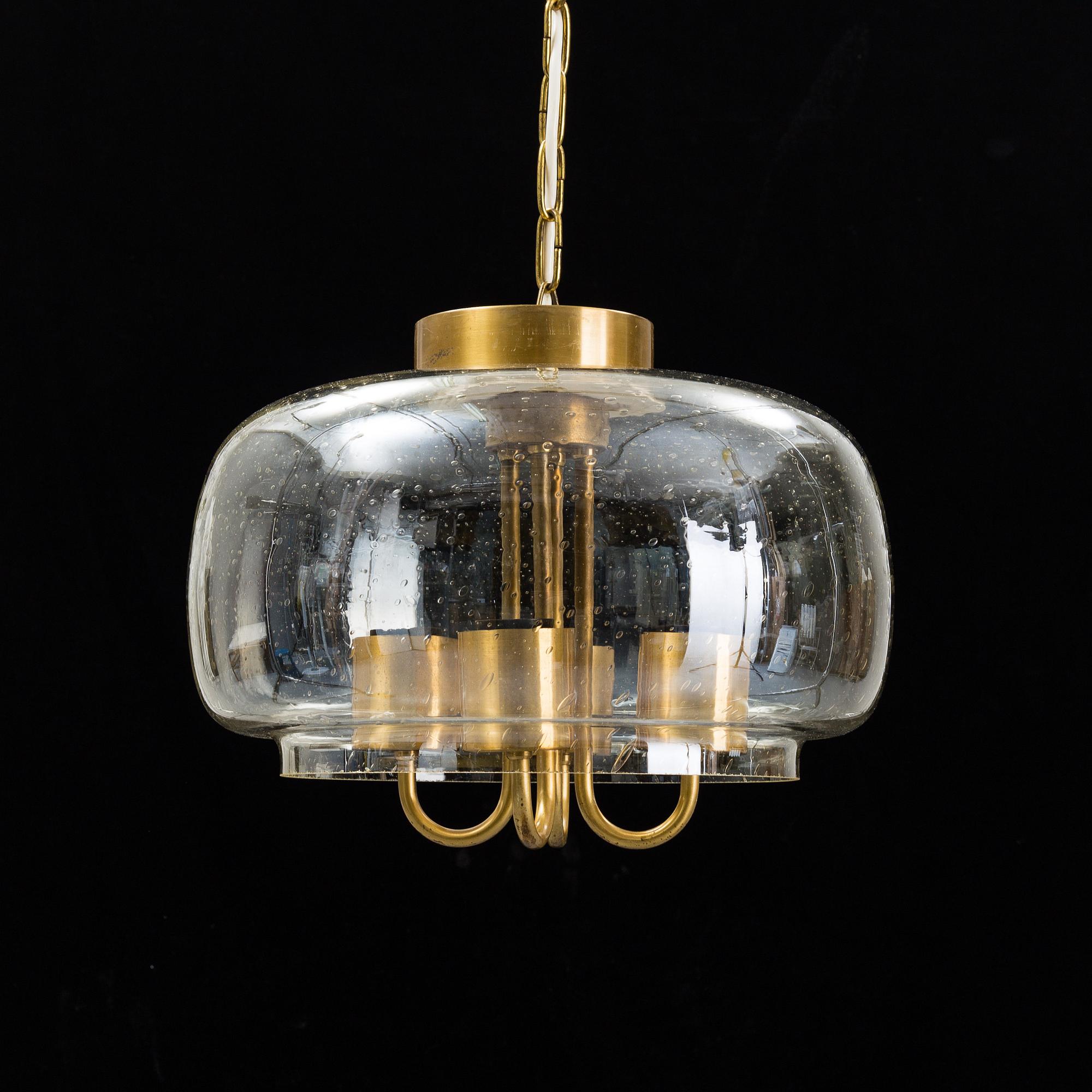 A 1960/70s glass and brass ceiling lamp.