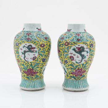 A pair of famille rose vases, China, early 20th Century.