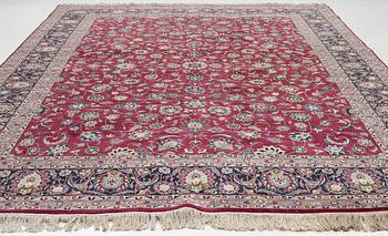 An oriental carpet, a. 378 x 278 cm.