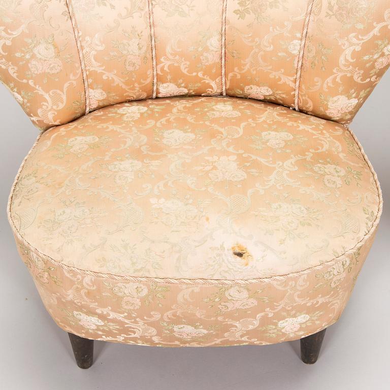 A pair of mid-20th century armchairs.