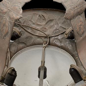 An early 20th Century art noveau copper ceiling light.