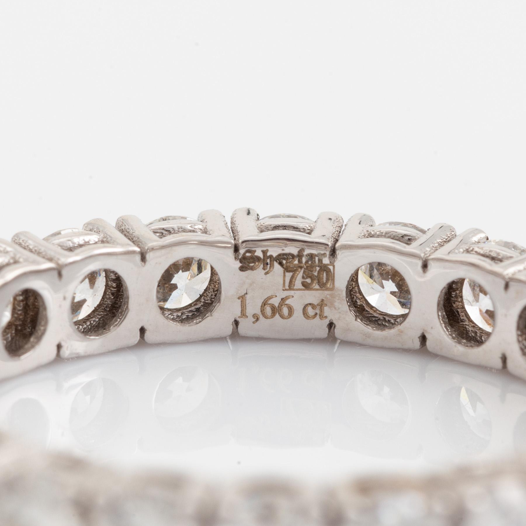 Brilliant cut diamond eternity ring.