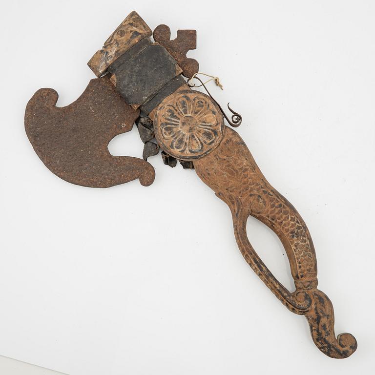 A set of three ceremonial Asmat axes and a sculpture object, Jakarta, Indonesia, 20th Century.