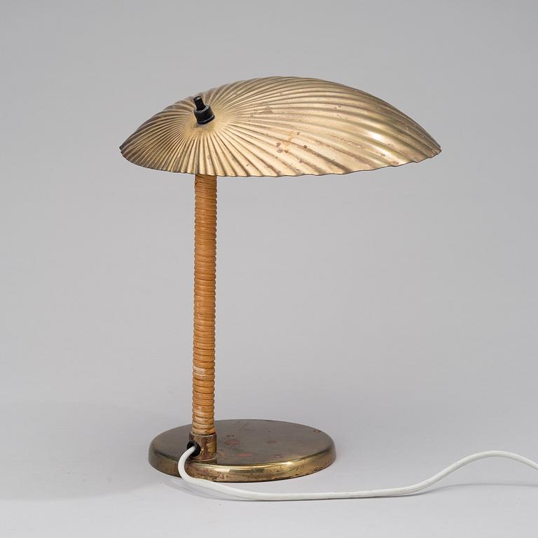 PAAVO TYNELL, A DESK LAMP. Shell. Manufactured by Taito Oy. Designed in 1938/-39.
