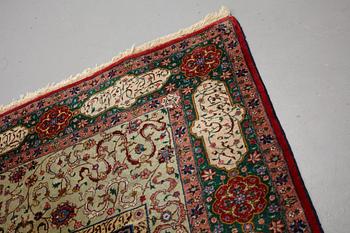 A carpet, semi-antique Tabriz, signed ca 335,5 x 256,5 - 261,5 cm.