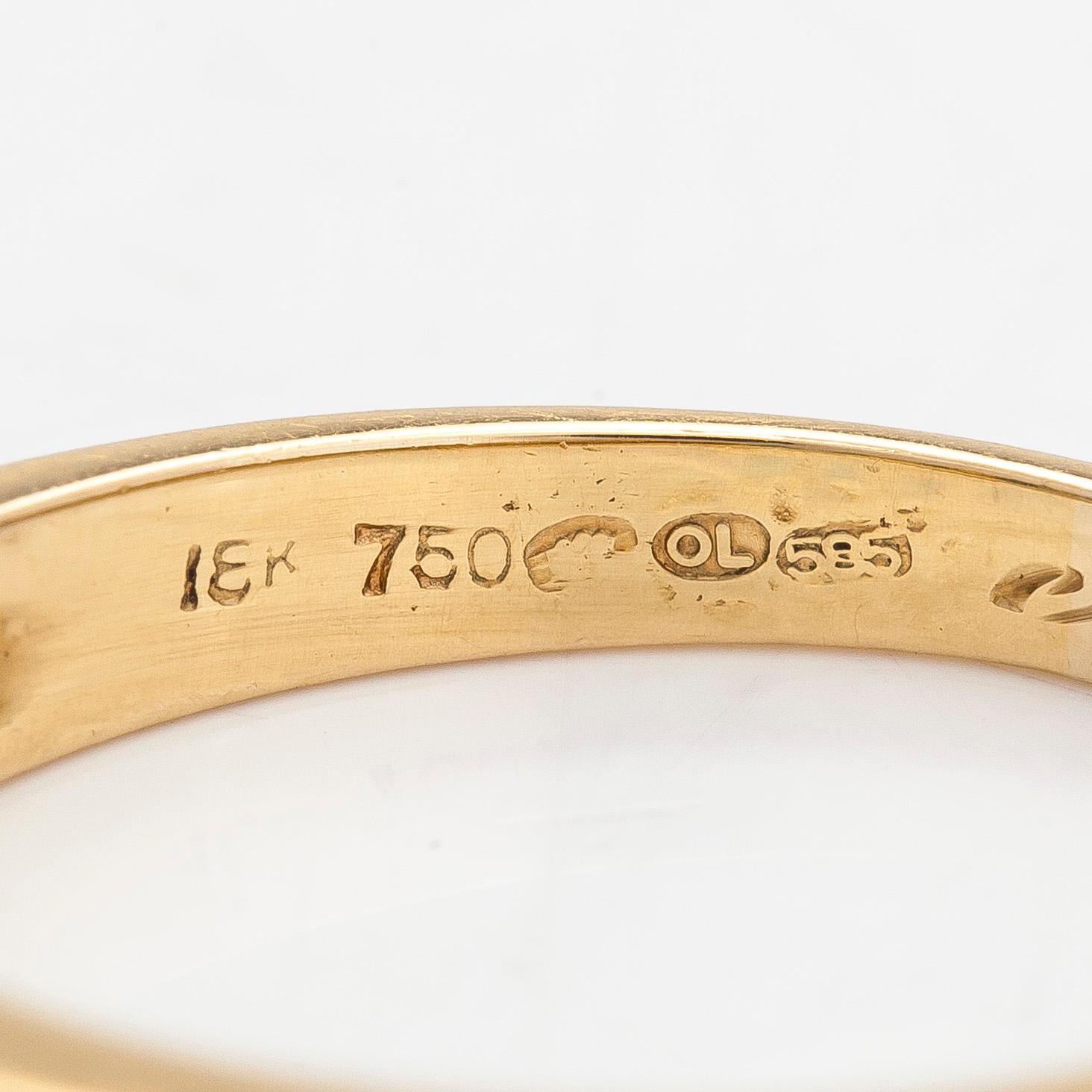 An 18K gold ring, set with emeralds and princess-cut diamonds totalling approx. 0.34 ct. Finnish import hallmarks.