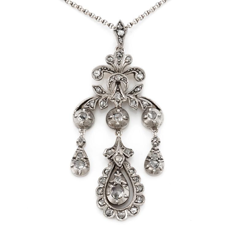 A silver chain and pendant set with rose-cut diamonds.