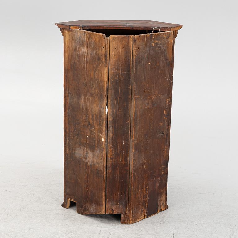 A corner cabinet, 18th Century.