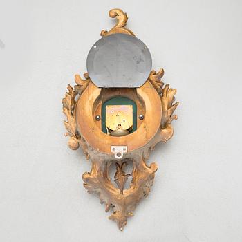 A rococo style wall clock, first half of the 20th century.