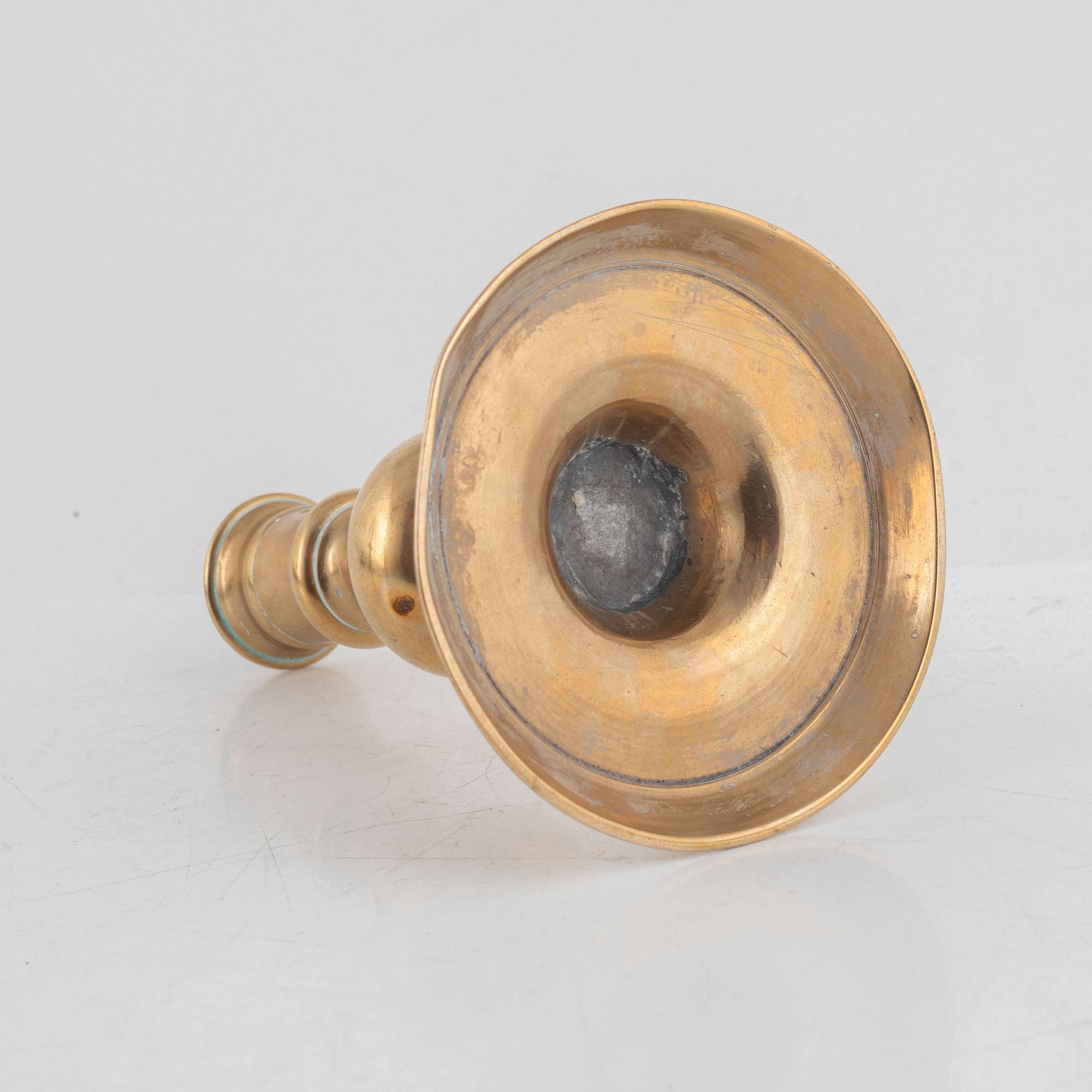 A Baroque brass candlestick, 17th century.