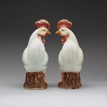 A pair of large white and brown glazed roosters, late Qing dynasty.