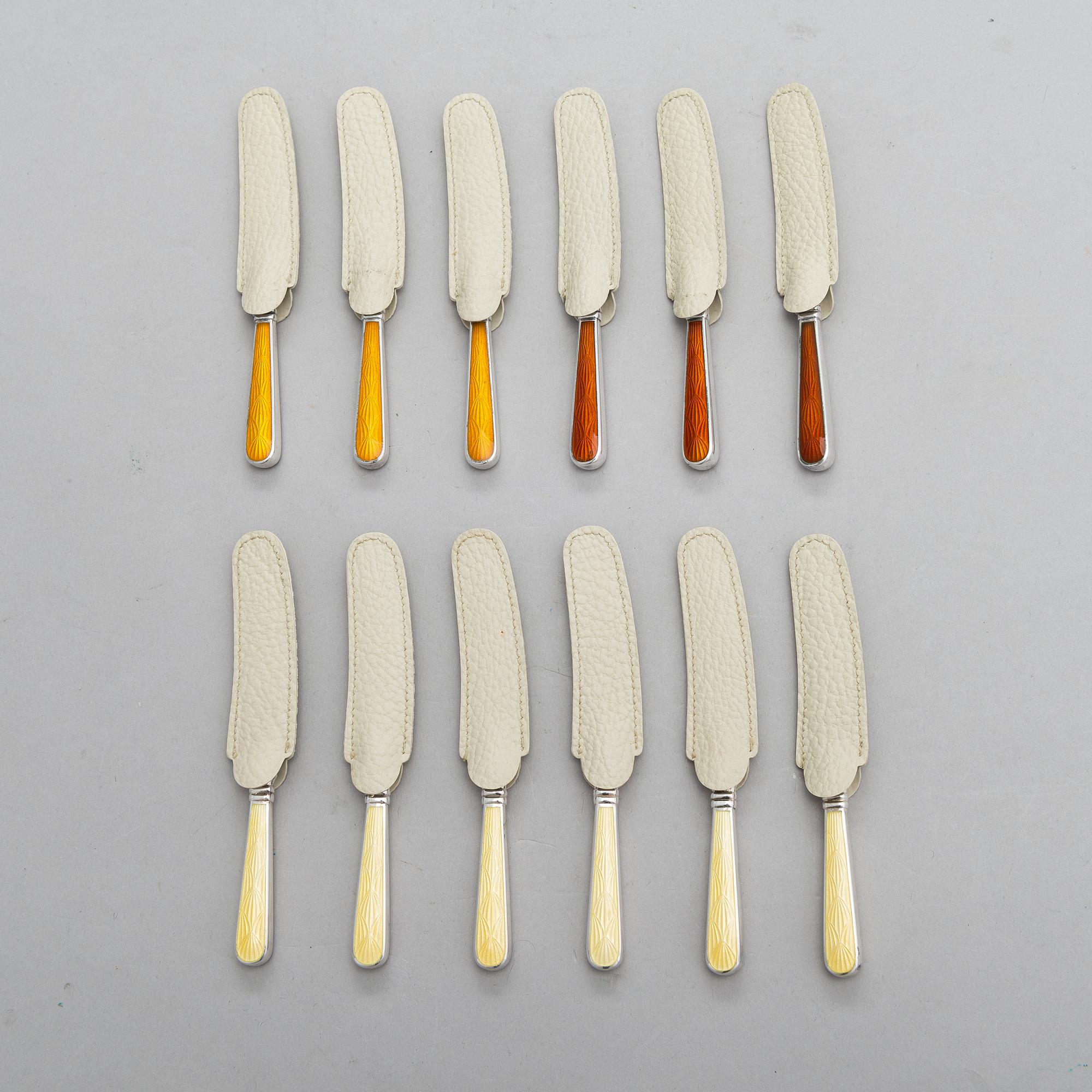 A set of twelve Tillander knives, enamel and silver (.916), Helsinki, Finland 1968. Danish steel blades.