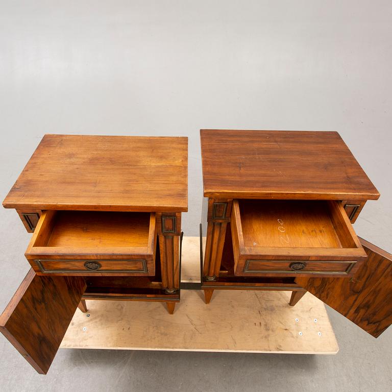 A pair of walnut Empire style bedside tables first half of the 20th century.