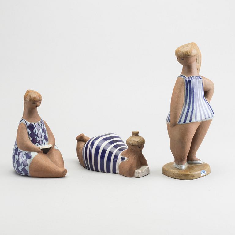 LISA LARSON, a set of three signed ceramic figurines.