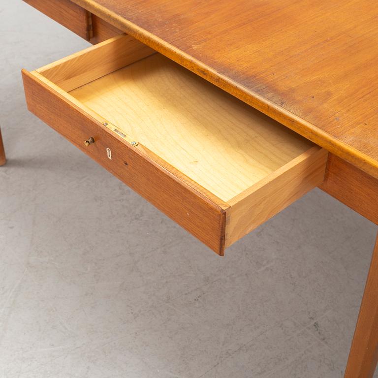 Folke Andersson, an 'Aristo' chair and a desk, Hugo Troeds, Bjärnum, mid 20th Century.